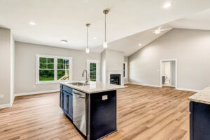 A kitchen and living room with hardwood floor